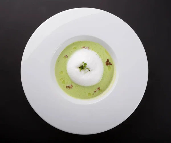 Green creamy vegetable soup in a white plate — Stock Image Green Creamy Vegetable Soup White Plate Royalty Free Stock Photos
