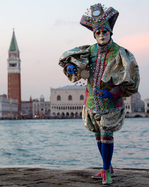 Reveller In Traditional Elaborate Mask And Costume At The Annual Venice Carnival (Carnevale di Venezia). Venice, Veneto, Italy, Europe
