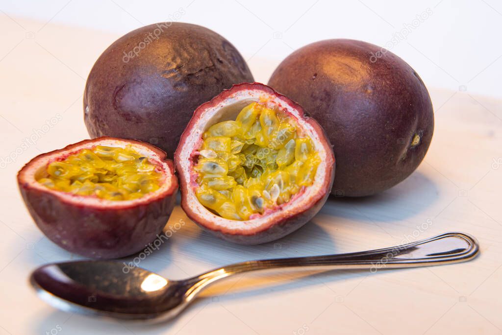 Cut passion fruit on a white table