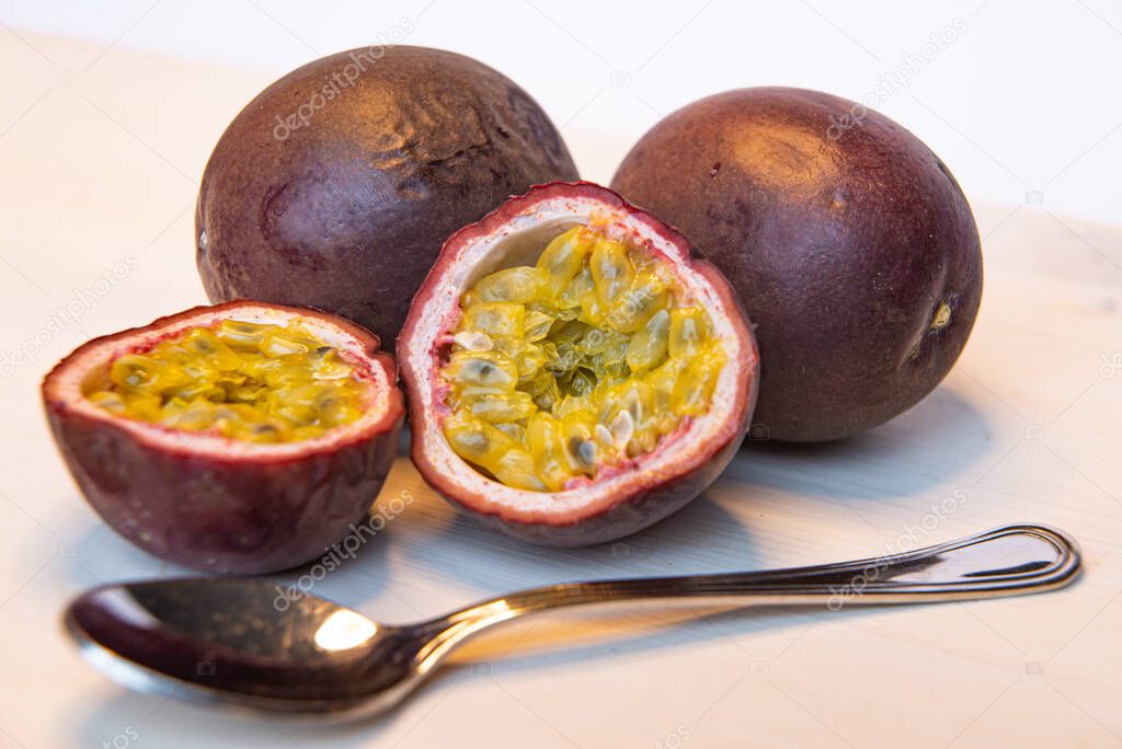Cut passion fruit on a white table