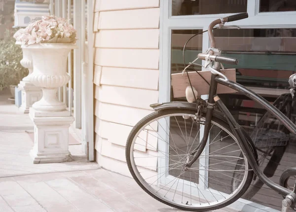 Vintage bicycle resting in the street.