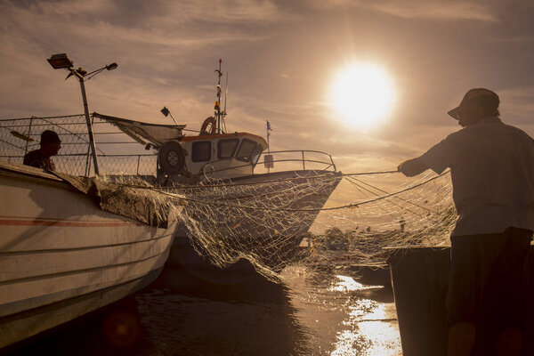 a fishermen at the evening the Town of Cabanas in Portugal