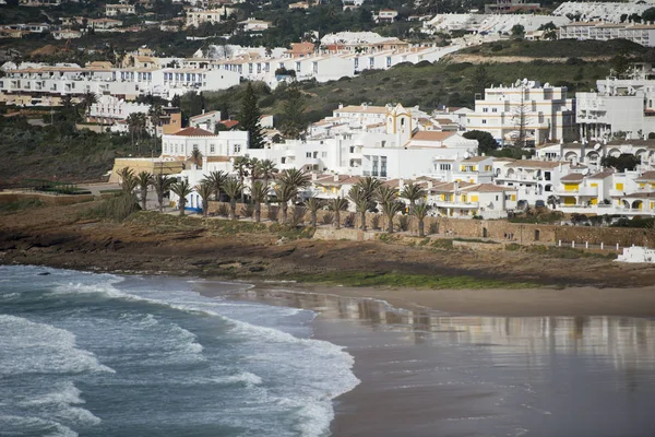 The beach with the village of Luz in Portugal — Stock Photo, Image