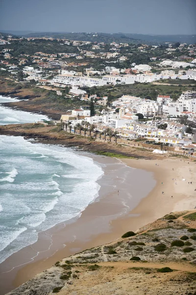 The beach with the village of Luz in Portugal — Stock Photo, Image