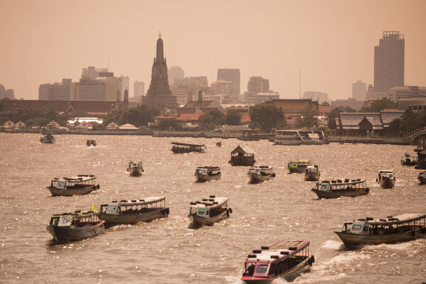 Boat trafic at the Chao Phraya river in the city of Bangkok in Thailand. Thailand, Bangkok, November, 2017.