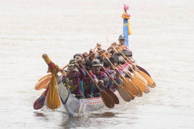 the tradititional Longboat Race at the Mun river of the town of Satuek north of the city Buri Ram in Isan in Northeast thailand. Thailand, Buriram, November, 2017. clipart