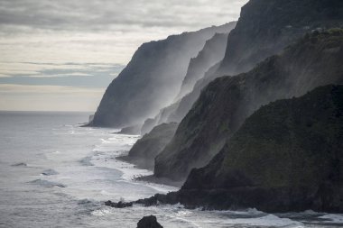 the Landscape on the coast betwen the Town Porto Moniz and Ribeira da janela on the Island of Madeira in the Atlantic Ocean of Portugal.  Madeira, Porto Moniz, April, 2018 clipart