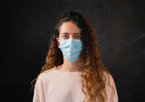 Coronavirus. Teenager wearing protection face mask against coronavirus.