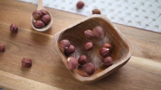 Hazelnuts In Wooden Bowl. Healthy Food Concept. — Stock Video