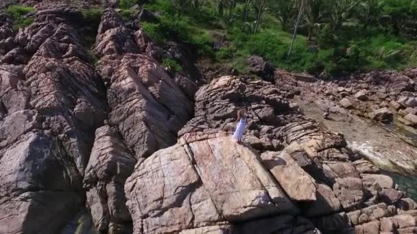 Aerial View: Woman on Top of Mountain — Stock Video