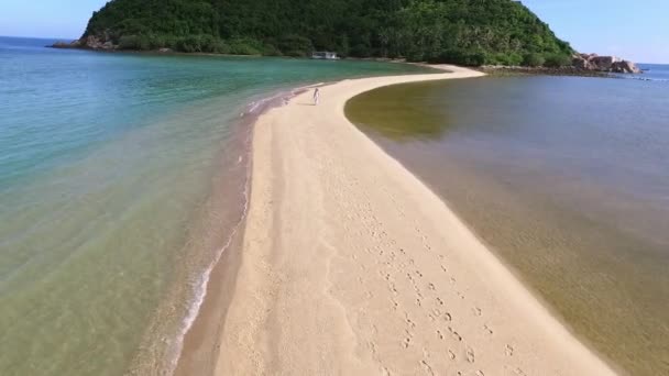 Woman in White Dress Walking on Beach by Sea. Aerial. — Stock Video