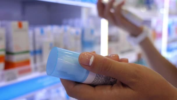 Woman Choosing Cosmetic in Beauty Shop. Closeup. — Stock Video