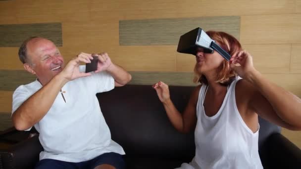 Middle-Aged Couple in VR Glasses Having Fun — Stock Video