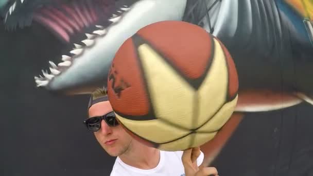 Young Man with Basket Ball Against Graffiti Wall - Thailand, april 2017 — Stockvideo