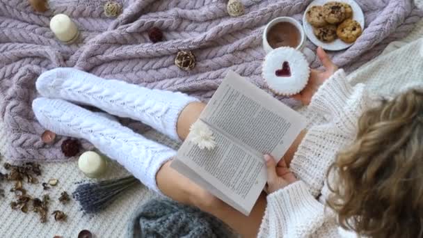 Top View Of Cosy Homey Woman In Knitted Socks Reading Book — Stock Video