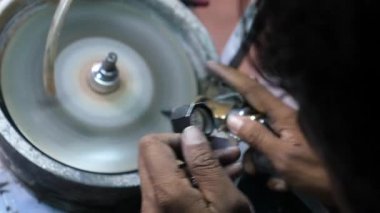 Lapidarist In Process Of Cutting And Polishing Gems