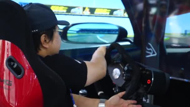 Male Car Driver Training In Simulator. Bangkok, Thailand - April 08, 2018. — ストック動画