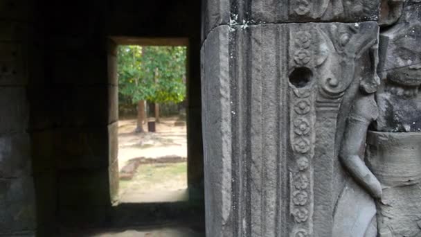 Mystic Doorway with Stone Carvings In Ancient Temple Of Angkor Wat — стоковое видео