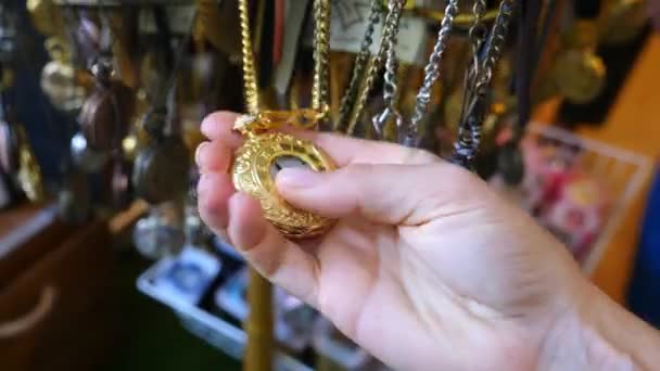 Customer Choosing Vintage Clock On Flea Market — Stock Video