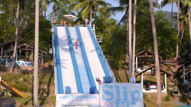 Man Flying on Extreme Water Slide in Summer Holidays. Slow Motion. — Stok video