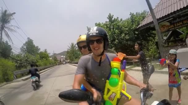 Happy Couple Driving Scooter in Songkran Festival — Stockvideo