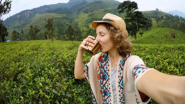Travel Technology And Adventure Concept. Woman Taking Selfie At Tea Plantation
