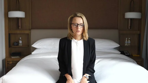 Stressed Business Woman Sitting On Bed Feel Tired