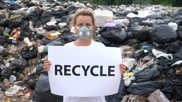 Pollution - Woman With Recycle Poster on Disposal Site. — ストック写真