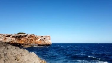 Porto Kristo kıyılarının manzarası, Mallorca Akdeniz Zaman Çizelgesi üzerinde