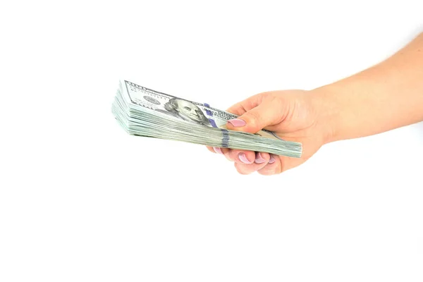 Női kéz tart dollár-bankjegyek a fehér háttér előtt. Közelről — Stock Fotó