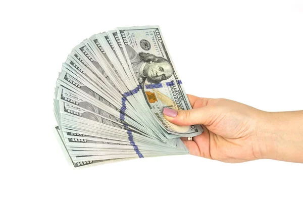 Női kéz tart egy csomó dollárt bankjegyek fehér alapon. Közelről — Stock Fotó
