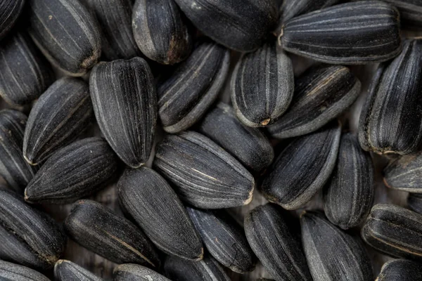 Black sunflower seeds. For texture or background. Close up — Stock Photo, Image