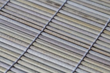 Suşi mat arka plan. Suşi yapmak için bambu hasır parçası makro.
