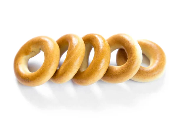 Öt száraz bagels elszigetelt fehér background — Stock Fotó