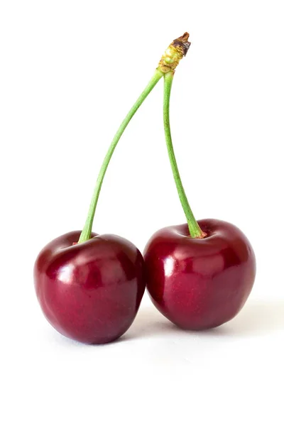 Két édes piros cseresznye, a szár elszigetelt fehér background — Stock Fotó