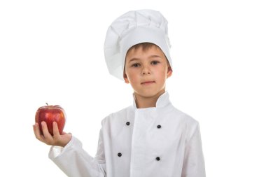 Sevimli genç Şef beyaz zemin üzerine kırmızı elma holding beyaz üniformalı