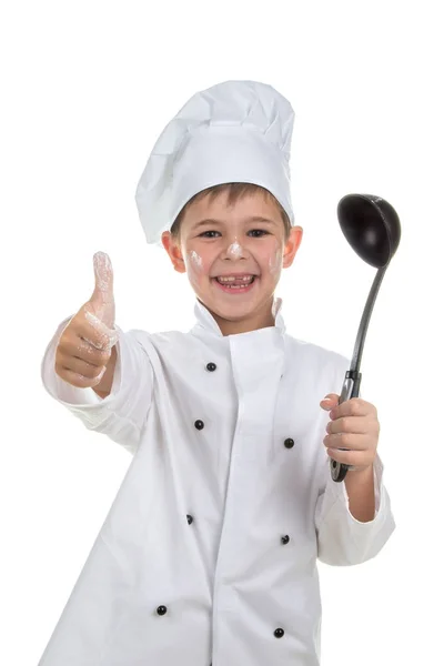 Roztomilý hravý malý kuchař s naběračka na bílém pozadí — Stock fotografie