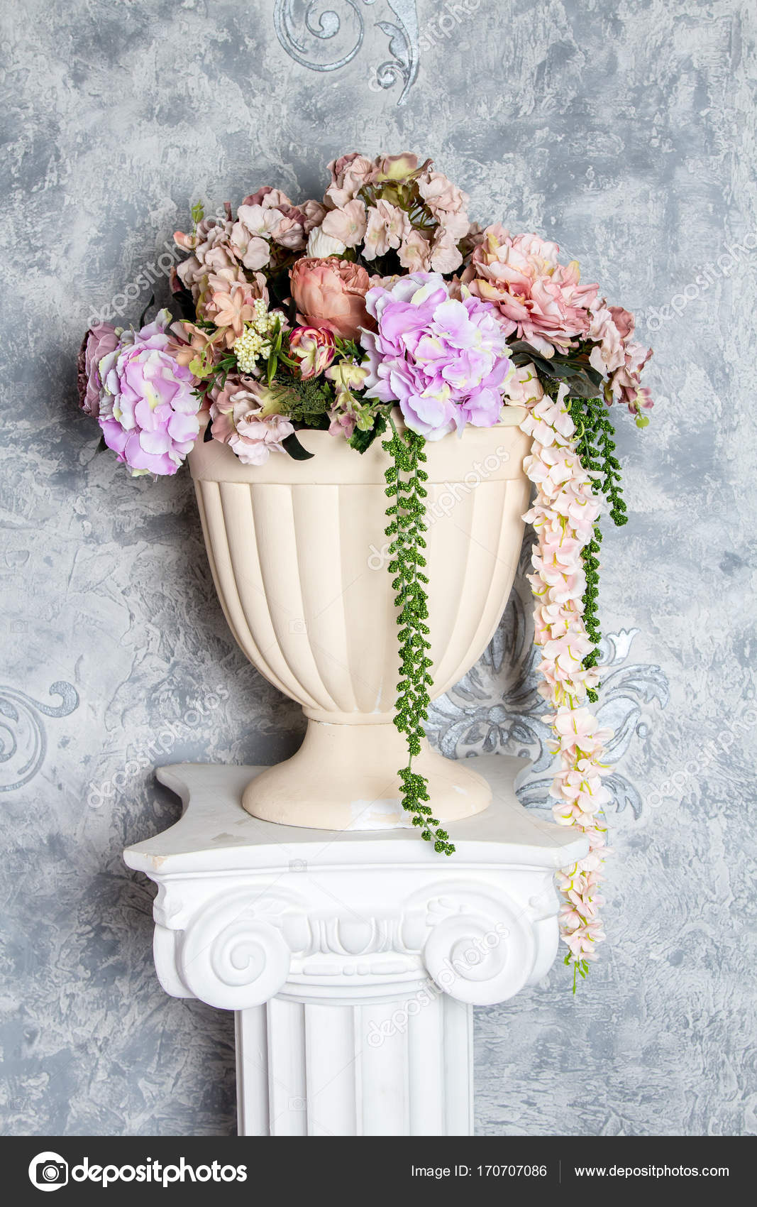 Artificial Flowers In Vase On The Greek Column Stock Photo