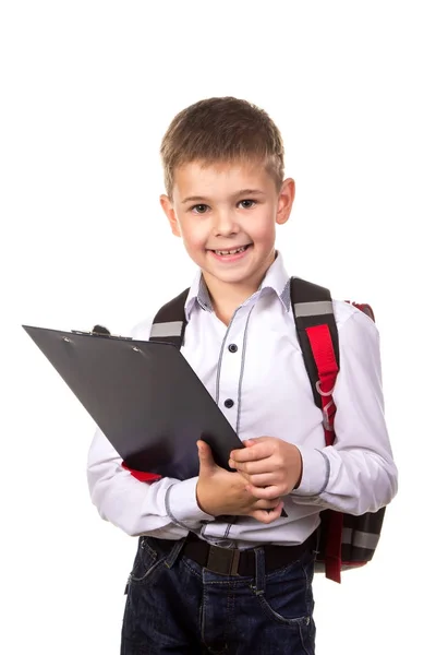 Niño de la escuela feliz con una tableta negra en sus manos. Imagen sobre el fondo blanco limpio —  Fotos de Stock