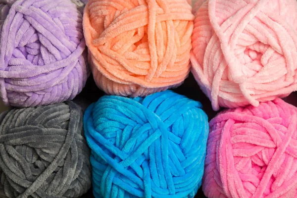 Six multicolored tangles of yarn and thread for knitting — Stock Photo, Image