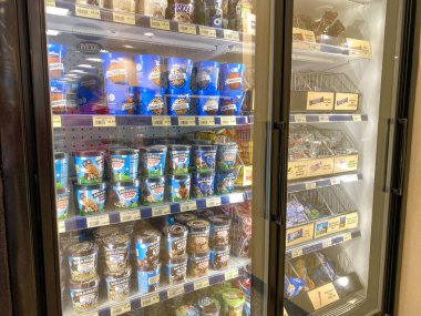 Orlando,FL/USA-12/27/19: The refridgerated ice cream display at a Wawa gas station, fast food restaurant, and convenience store. clipart