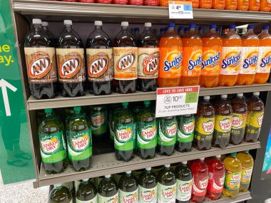 Orlando, FL/USA - 5/4/20: A display of 7Up Products including A&W Root Beer, Sunkist, Canada Dry Ginger Ale at a Publix Grocery Store. clipart