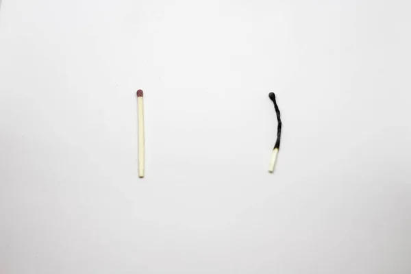 Two whole matches on a white background
