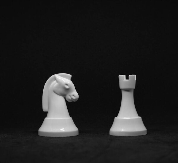 White chess are on a black background