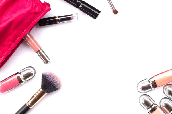 Makeup bag with a set of cosmetics on a white background close-up