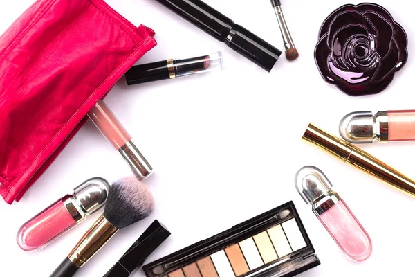 Makeup bag with a set of professional cosmetics on a white background close-up