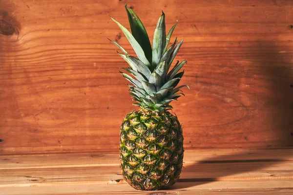 pineapple over wood, front view