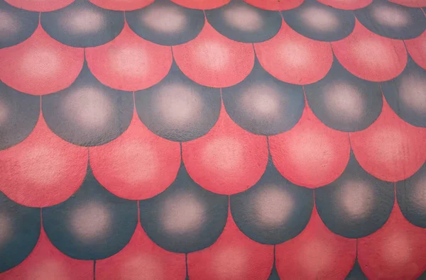 Image of decorative elements of the half-round painted forms.Painted surface of wall in by volume of looking half-round forms