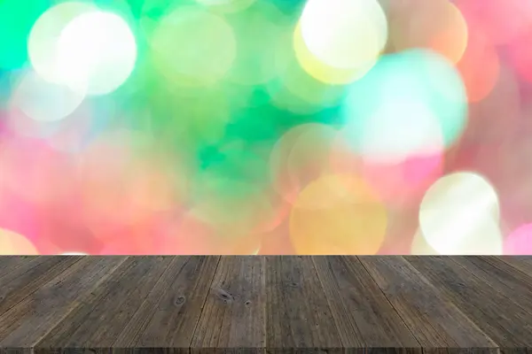 Abstrakta bokeh av ljus med trä terrass — Stockfoto
