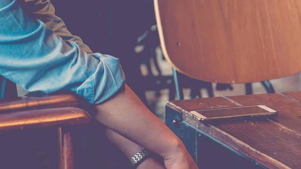 Mobile phone and women in coffee shop — Stock Photo, Image